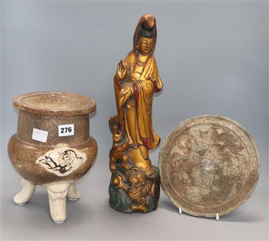 A Chinese crackle glaze tripod censer, a giltwood figure of Guanyin and a cast metal mirror tallest 42cm